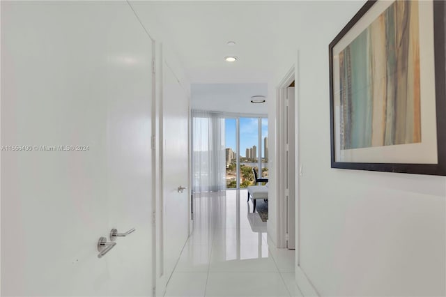 hall featuring light tile patterned floors