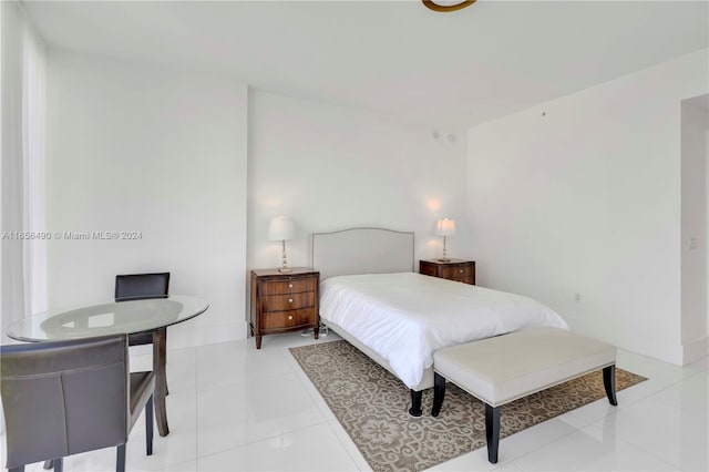 bedroom featuring light tile patterned flooring