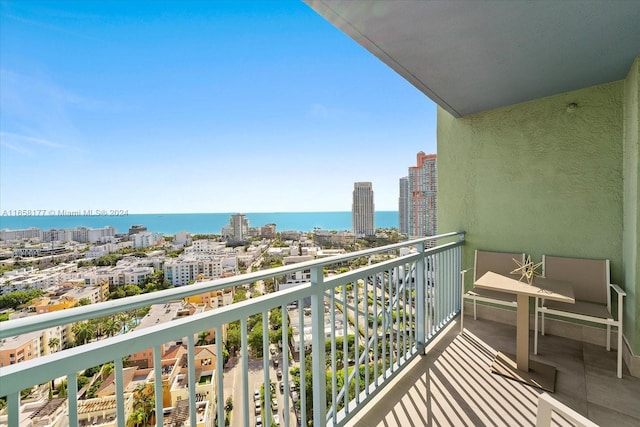 balcony featuring a water view