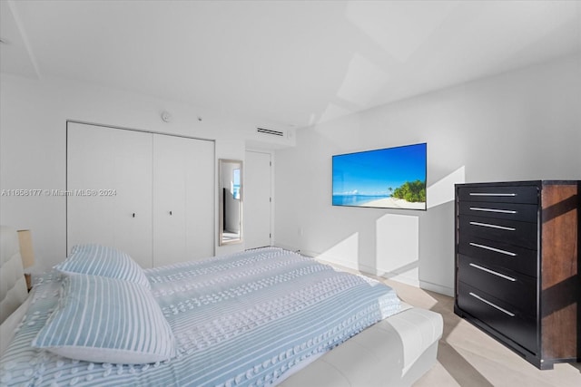 carpeted bedroom featuring a closet