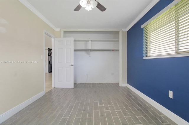 unfurnished bedroom with a closet, ceiling fan, hardwood / wood-style flooring, and ornamental molding