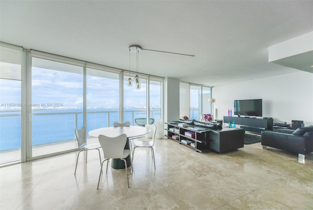 665 NE 25th St Unit 1704, Miami, FL 33137 - dining space with a wall of windows and a textured ceiling