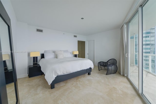 665 NE 25th St Unit 1704, Miami, FL 33137 - bedroom featuring access to exterior, multiple windows, and light tile patterned floors