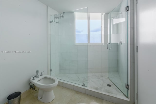 665 NE 25th St Unit 1704, Miami, FL 33137 - bathroom featuring a stall shower, a bidet, and marble finish flooring