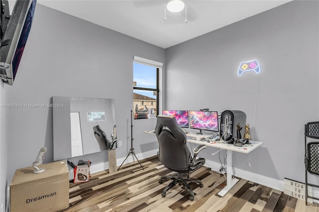 office space featuring wood-type flooring and ceiling fan