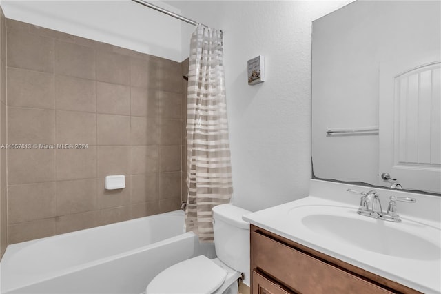 full bathroom with vanity, toilet, and shower / bath combination with curtain