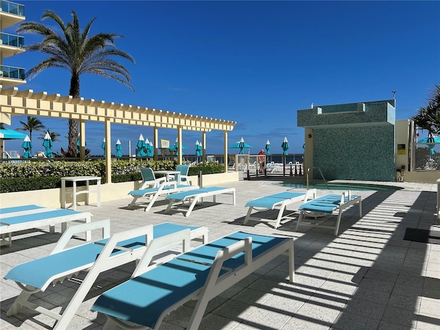 view of swimming pool with a pergola and a patio area