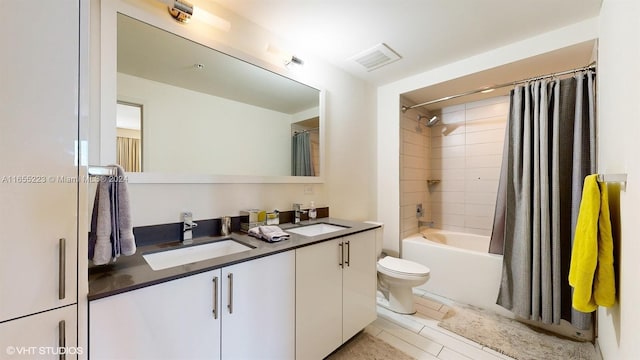 full bathroom with vanity, tile patterned flooring, toilet, and shower / tub combo with curtain