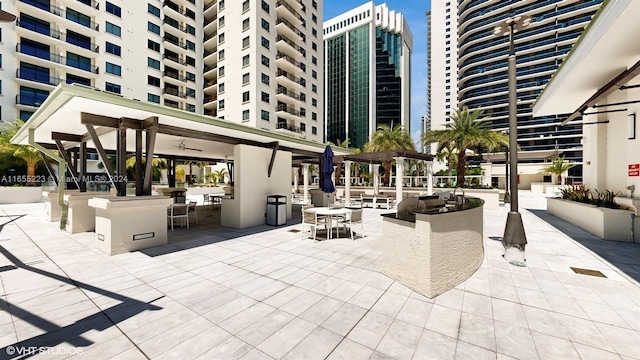 view of home's community featuring a patio and an outdoor living space