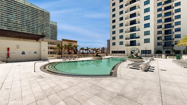 view of swimming pool featuring a patio area