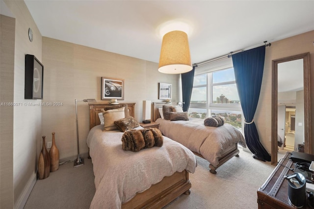 bedroom featuring light carpet