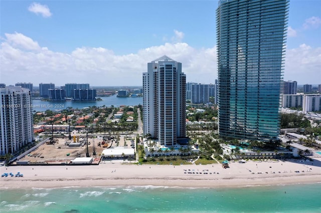 view of city featuring a view of the beach and a water view