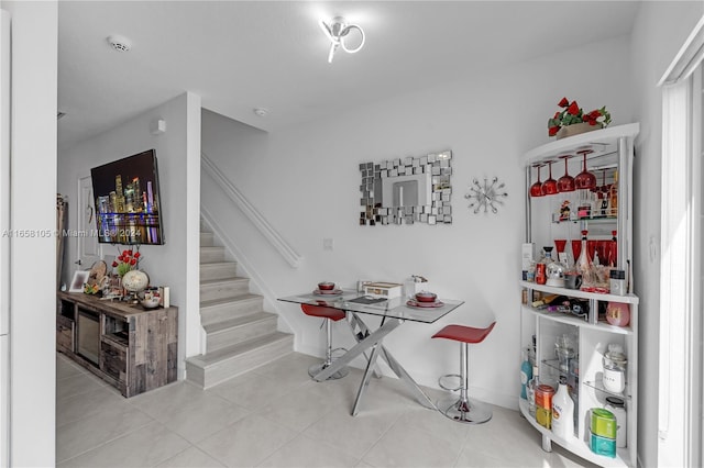 interior space with light tile patterned floors