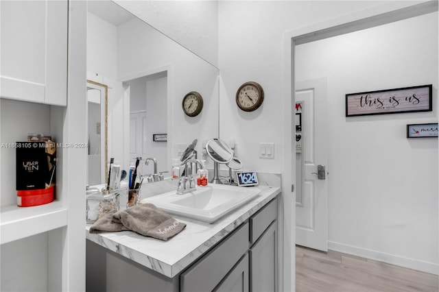 bathroom featuring vanity and hardwood / wood-style floors