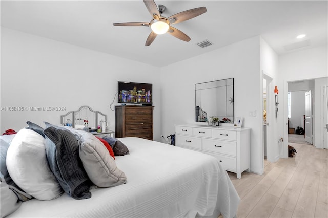 bedroom featuring light hardwood / wood-style flooring and ceiling fan