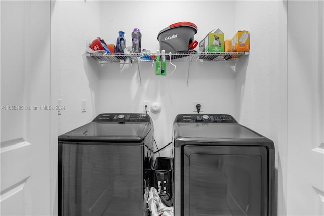 laundry room with washing machine and clothes dryer