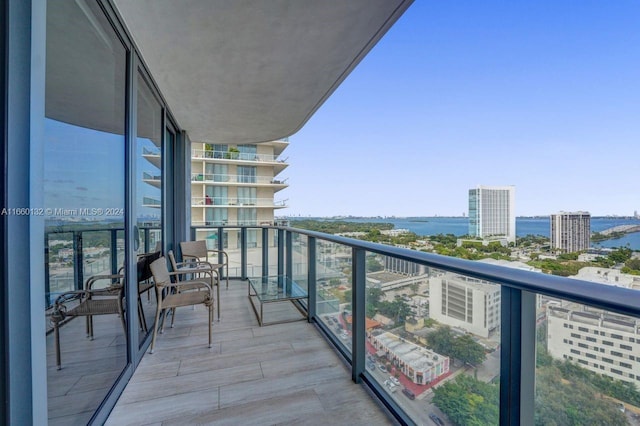 balcony featuring a water view