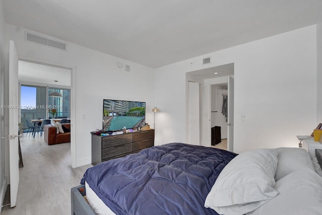 bedroom with light hardwood / wood-style flooring