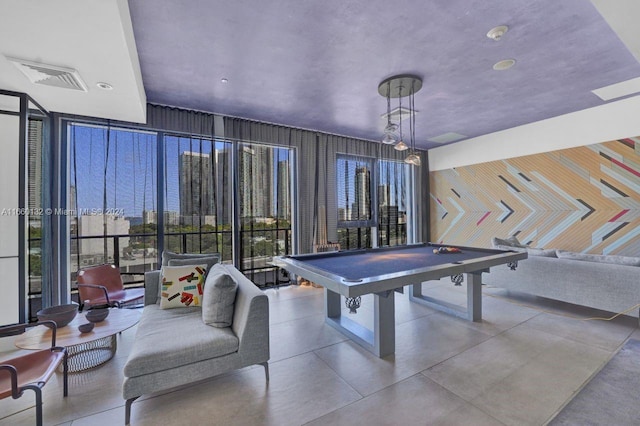 game room featuring billiards and floor to ceiling windows