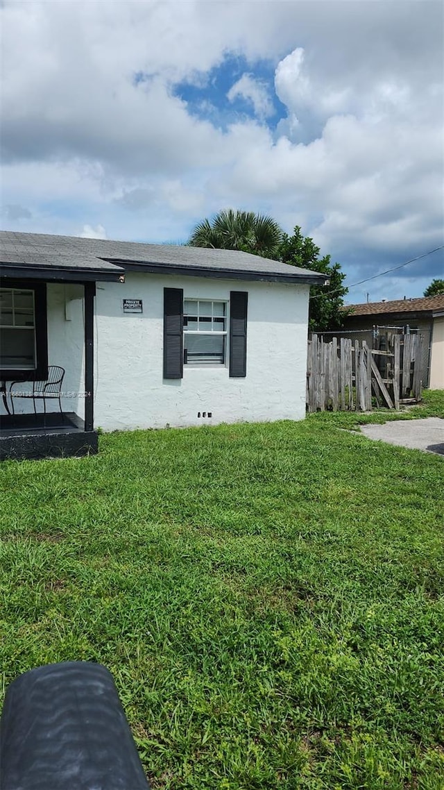 view of home's exterior featuring a lawn