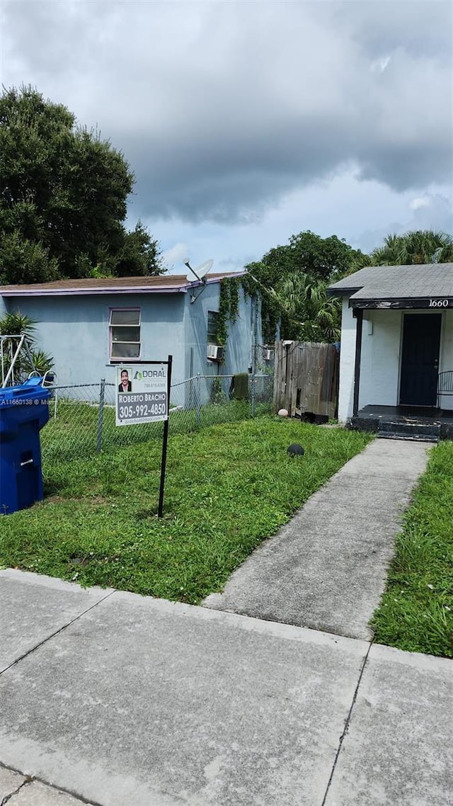 view of side of property featuring a yard