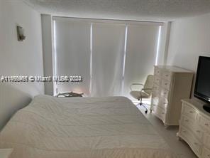 bedroom featuring a textured ceiling