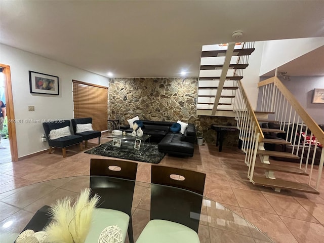 living room with tile patterned flooring