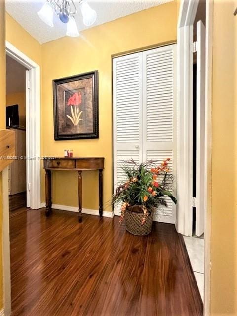 hall with hardwood / wood-style floors