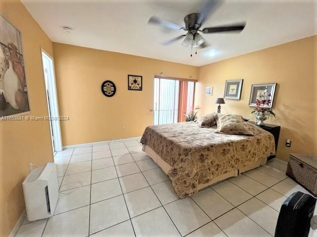 tiled bedroom with ceiling fan