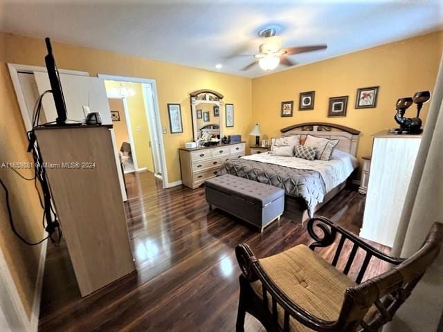 bedroom with ceiling fan and dark hardwood / wood-style flooring