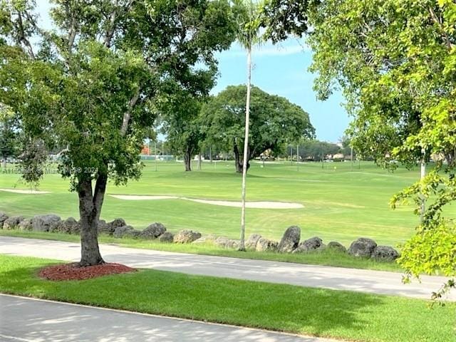 view of home's community with a lawn