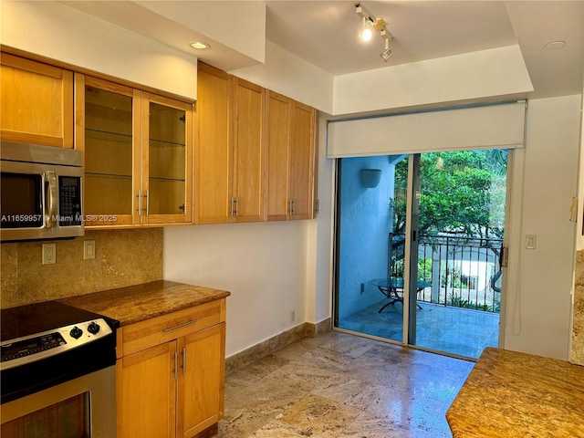 kitchen featuring range with electric stovetop and backsplash