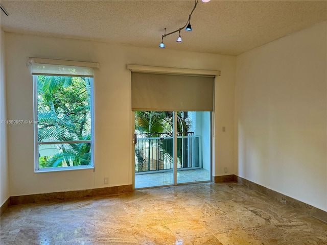 empty room with a textured ceiling