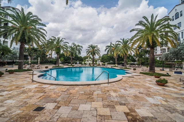 view of swimming pool with a patio