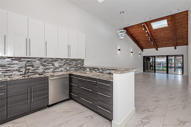 kitchen with white cabinets, vaulted ceiling with skylight, light stone counters, and wooden ceiling