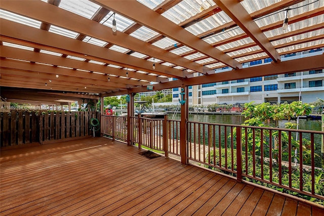 wooden terrace with a pergola and a water view