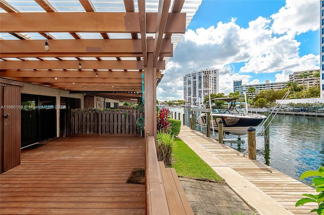 dock area featuring a pergola and a water view