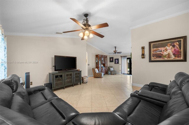 living room featuring crown molding, vaulted ceiling, light tile patterned floors, and ceiling fan