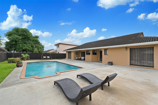 view of swimming pool with a patio area