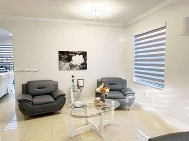 tiled living room with ornamental molding