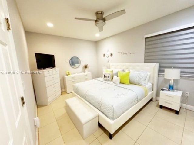 bedroom featuring light tile patterned floors and ceiling fan