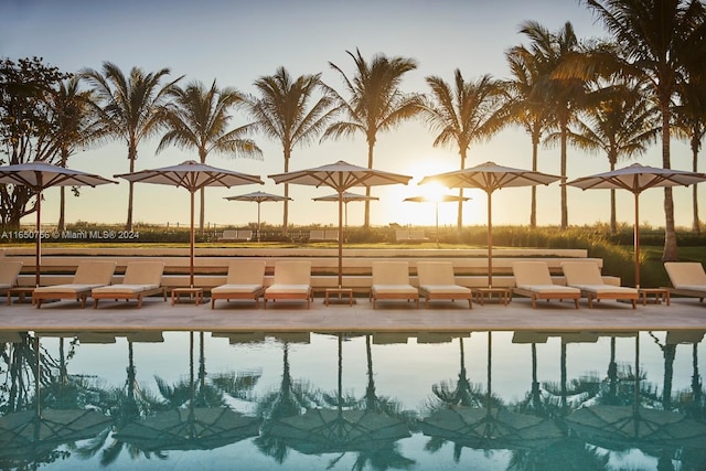 view of pool at dusk