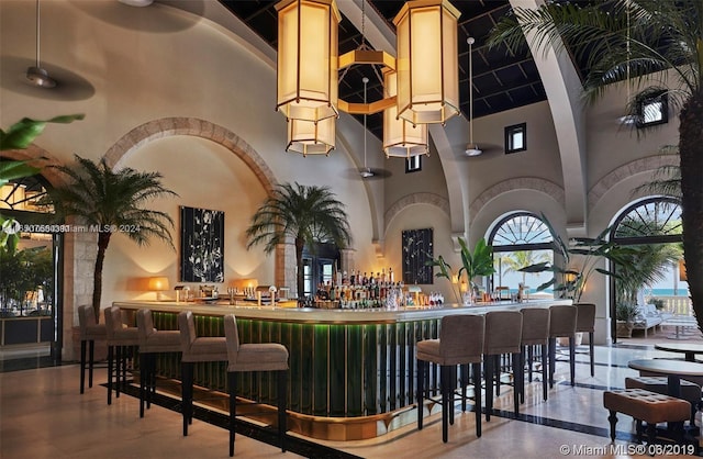 bar with light brown cabinetry