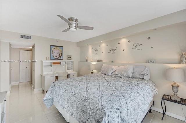 bedroom featuring light tile patterned floors and ceiling fan