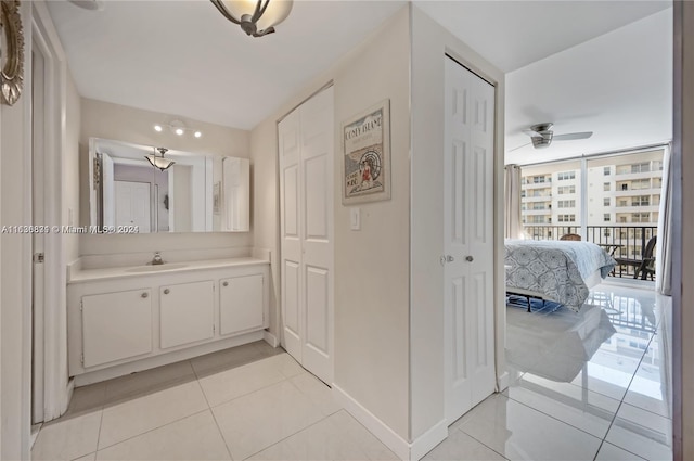 bathroom with vanity, ceiling fan, and tile patterned floors