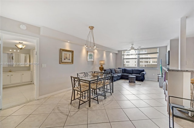 tiled dining area featuring ceiling fan