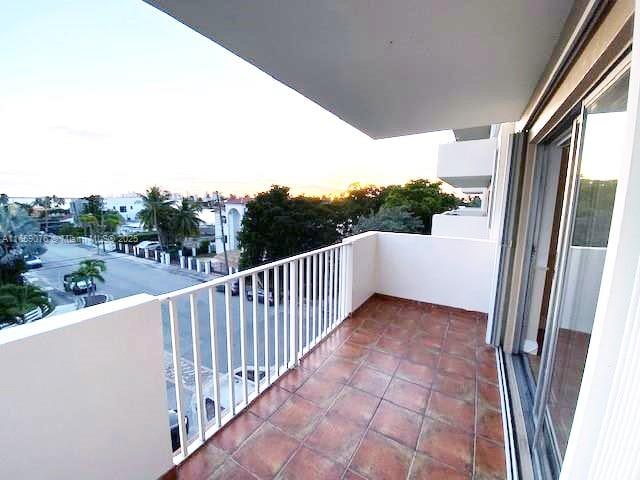 view of balcony at dusk