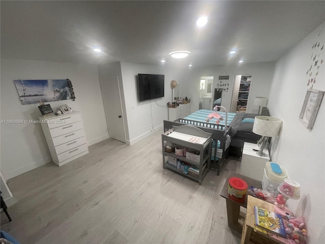 game room with light hardwood / wood-style flooring