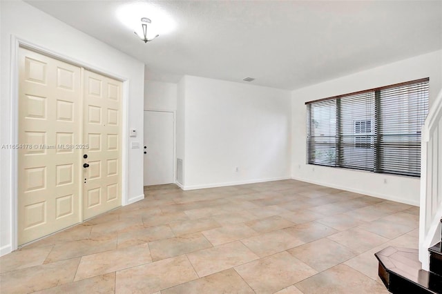 interior space with visible vents and baseboards