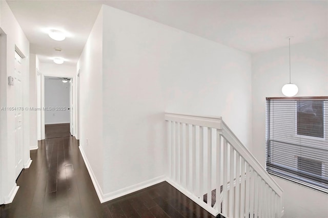 corridor featuring dark hardwood / wood-style flooring